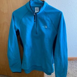 Green and blue north face sweatshirts